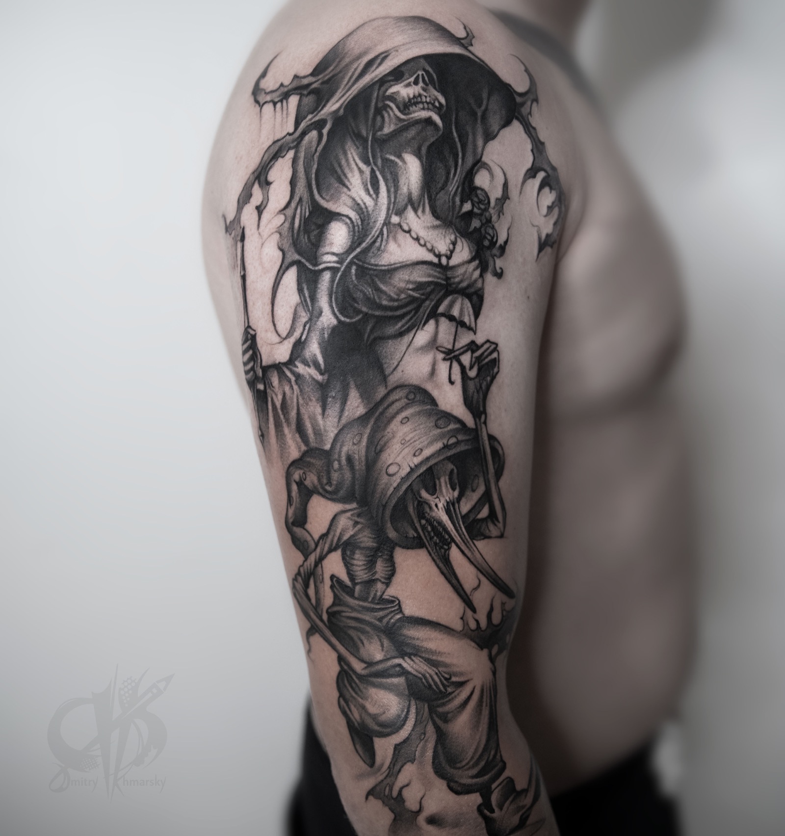 Black and grey surreal tattoo with skeletal figures