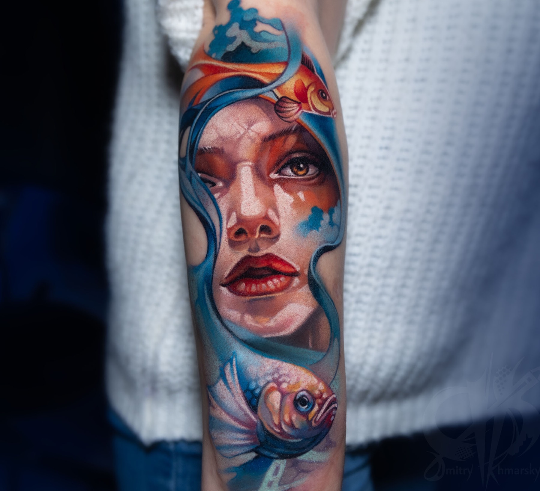 Color portrait tattoo with fish and blue painterly movement