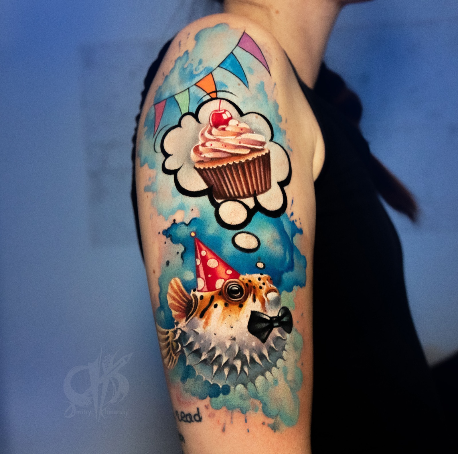Color tattoo with puffer fish, cupcake, and party details